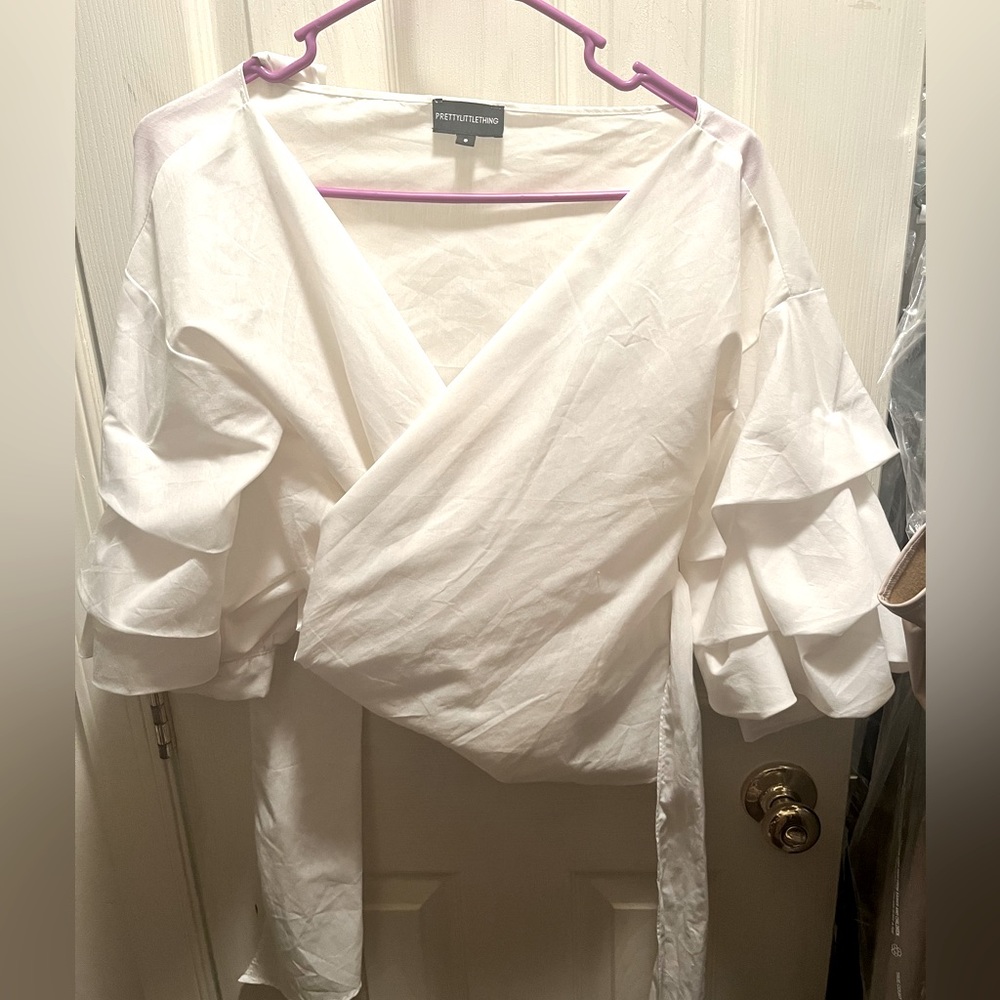 White wrap shirt with exaggerated sleeves